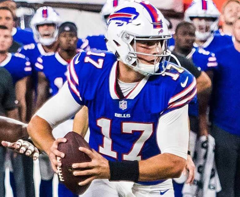 Buffalo Bills quarterback Josh Allen drops back and is ready to throw a pass.